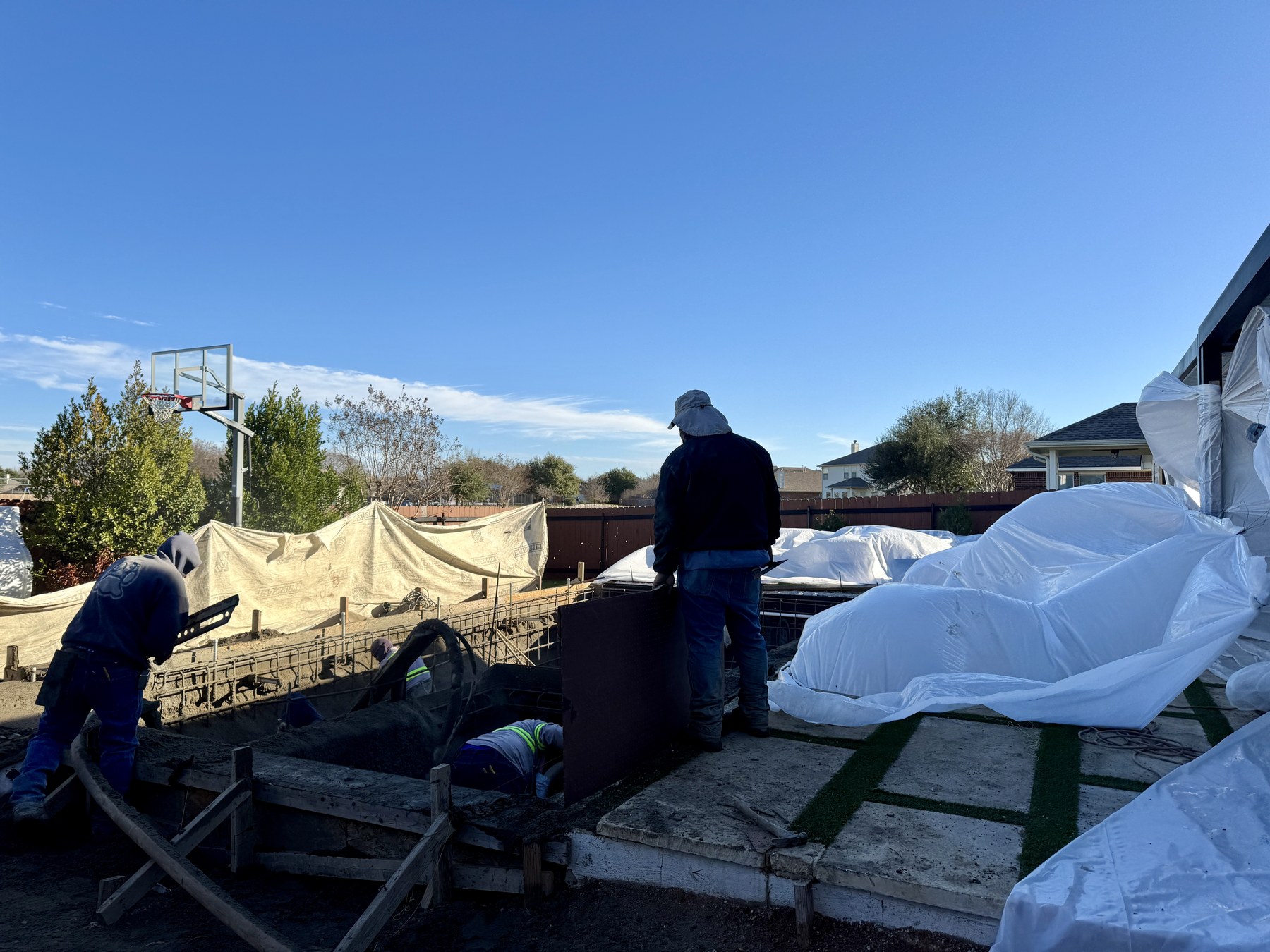 Crew shooting ASR-Free Certified Gunite Mix during partial pool rebuild