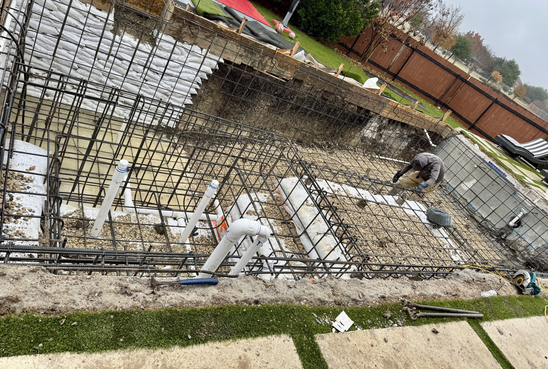 Pool rebuild site with soil stabilization and reinforcement work